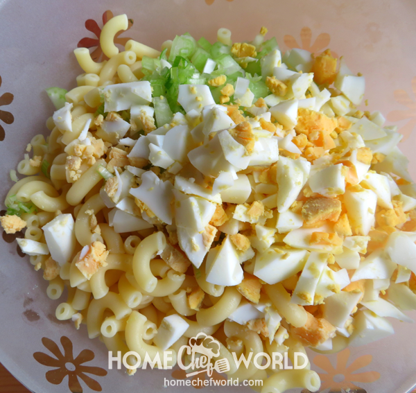 Adding Ingredients Together for Mom’S Macaroni Salad